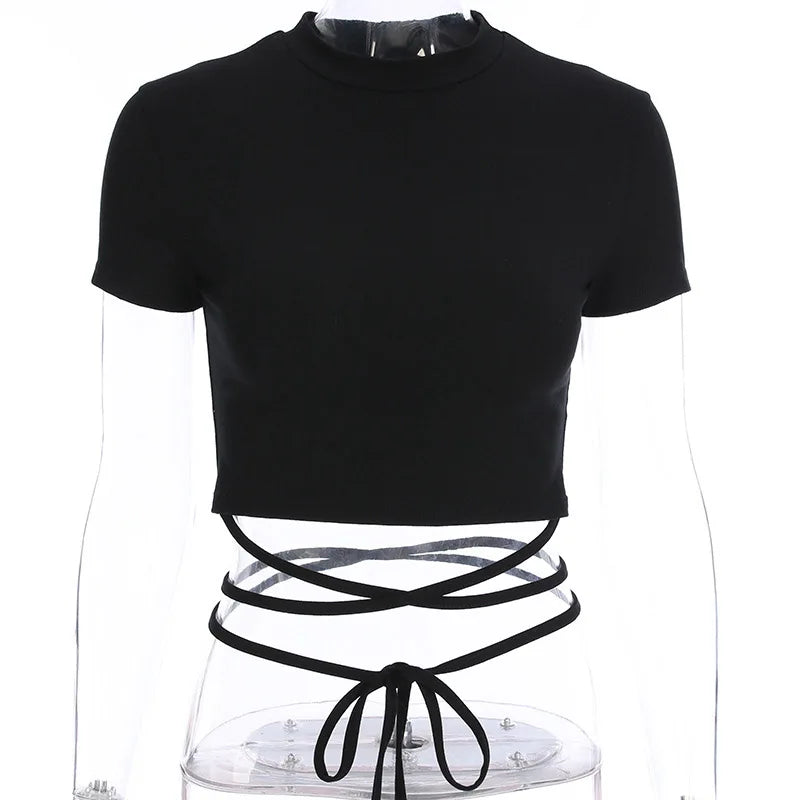 Black round-neck crop top on a clear mannequin, with long ties crossed around the waist and tied at the front.