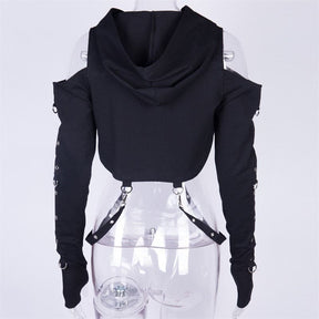 Black buckled baddie hooded shrug with long fitted sleeves, shoulder straps, and silver metal rings along the arms