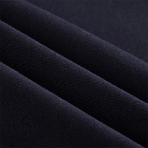 Black soft-textured fabric with a subtle woven pattern on the buckled baddie long sleeve hoodie with fitted sleeves