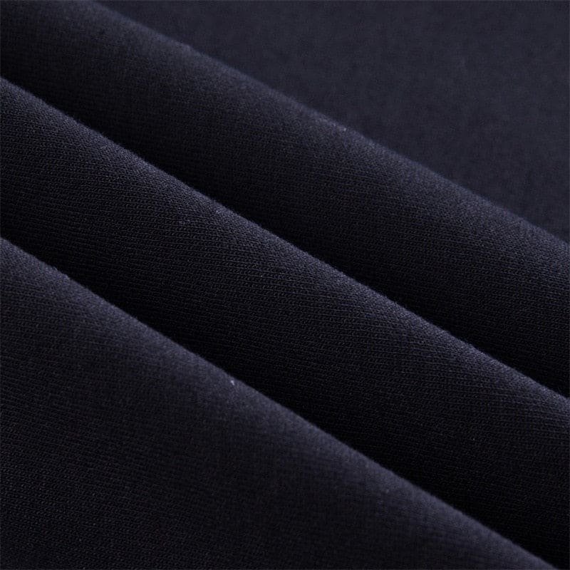 Black soft-textured fabric with a subtle woven pattern on the buckled baddie long sleeve hoodie with fitted sleeves