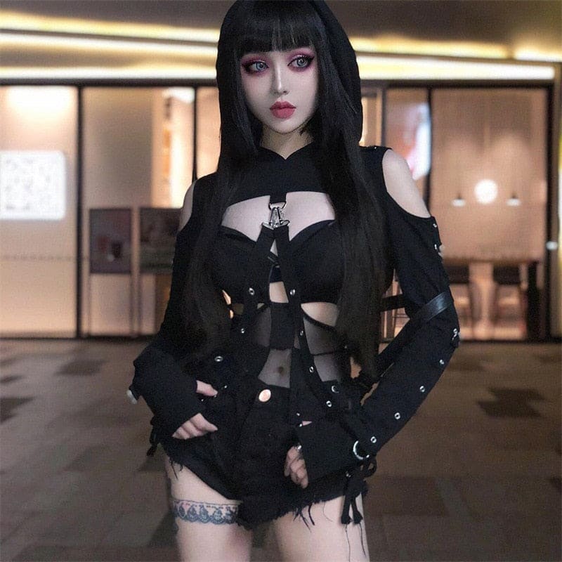 Black gothic corset top with cutouts metal hardware and frayed edges featuring fitted long sleeves hooded shrug style