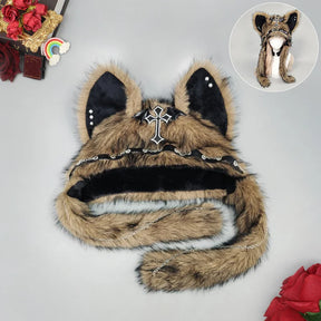 Camel cat ear winter hat with a plush finish, black inner ears, cross ornament and long flaps.