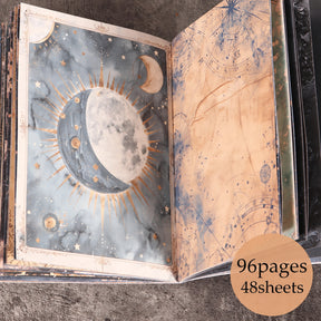 Open witchy journal showing a pale blue moon illustration opposite warm-toned celestial map artwork.
