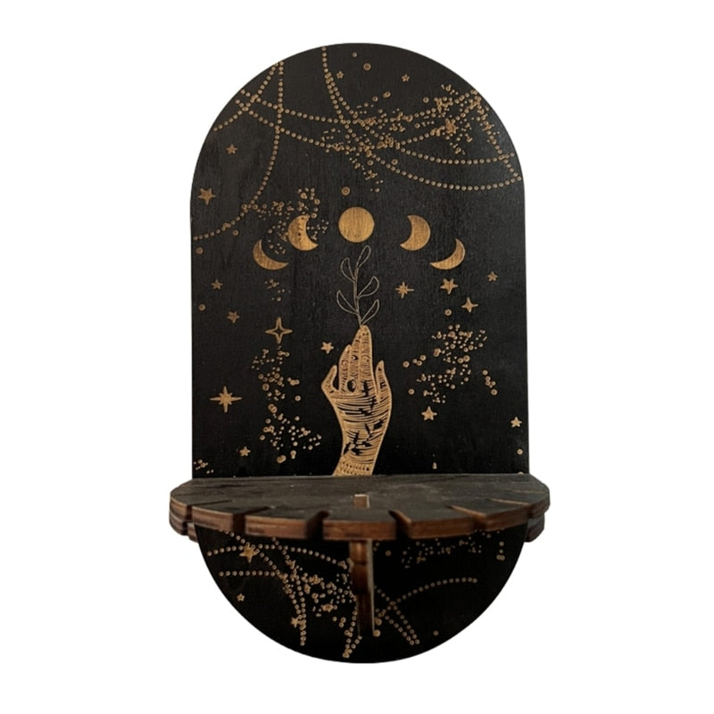 Moon Phases wooden shelf with an illustrated hand holding a leafy stem beneath gold-tone moons and hanging-chain artwork.