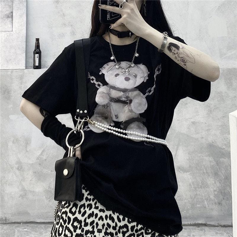 Black teddy bear tee featuring a graphic of a teddy bear with silver chains and pearl embellishments for dark fashion fans