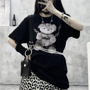 Black t-shirt with a teddy bear graphic featuring silver chains and pearl details perfect for dark fashion fans