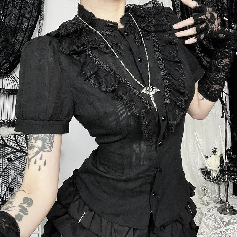 Close-up of gothic ruffle blouse showing puff sleeve and decorative trim