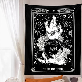 Black-and-white Coffee wall tapestry displayed above a bed, creating a high-contrast card-like focal point beside a window.