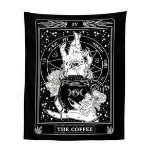 Black-and-white Coffee tarot-style tapestry with a cup, illustrated hands, roses and stars inside an ornate rectangular frame.