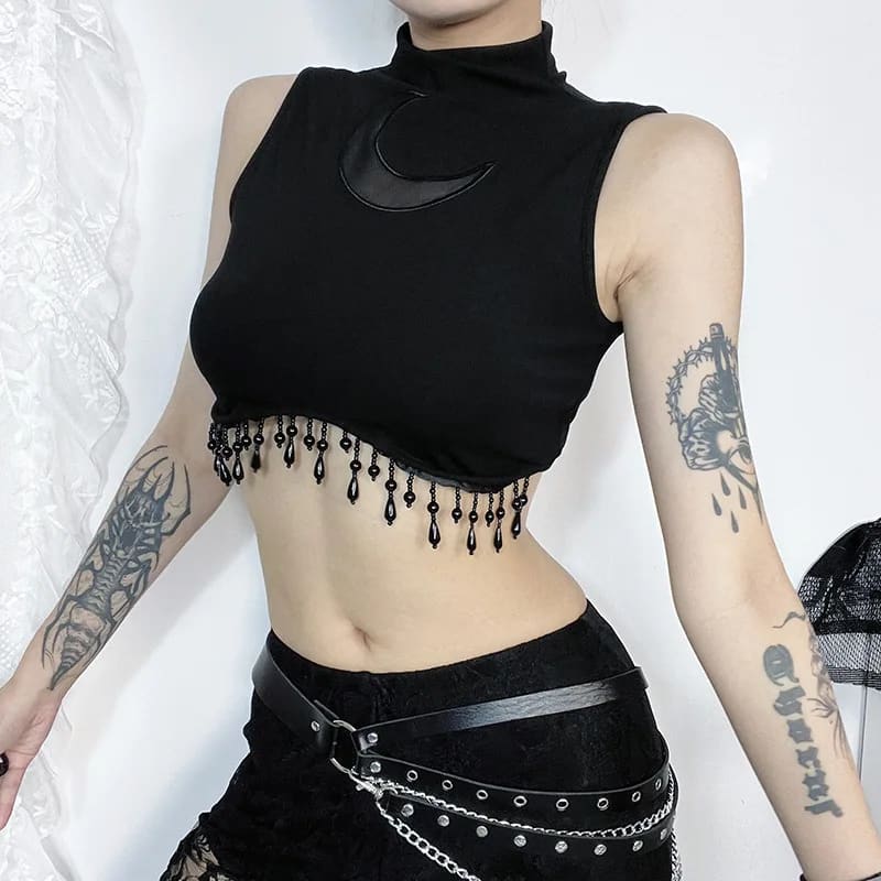 Side view of the crescent moon crop top showing the high neckline and beaded hem