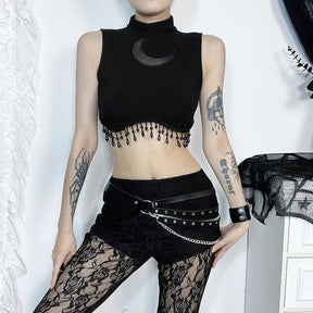 Crescent moon fringe crop top styled with black shorts for a witchy outfit