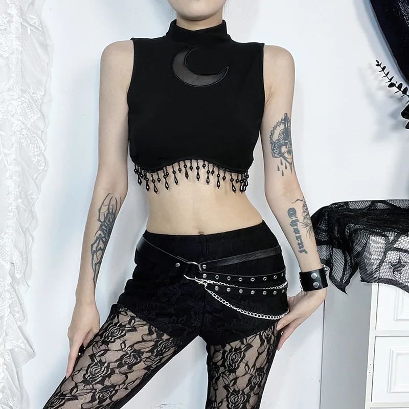 Crescent moon fringe crop top styled with black shorts for a witchy outfit
