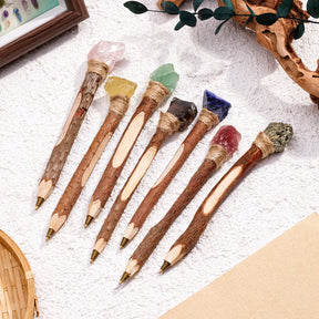A selection of crystal topped pens on a pale textured background