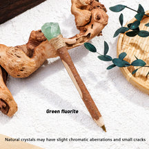 Green crystal topped ballpoint pen with a wrapped collar and textured barrel