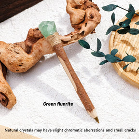 Green crystal topped ballpoint pen with a wrapped collar and textured barrel