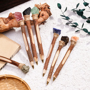 Witchy ballpoint pens arranged with rustic desk decorations