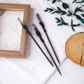 Green and purple banded crystal points on dark witchy hair sticks