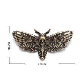 Gold-tone moth brooch isolated on white with supplier measurement annotations around its spread wings.