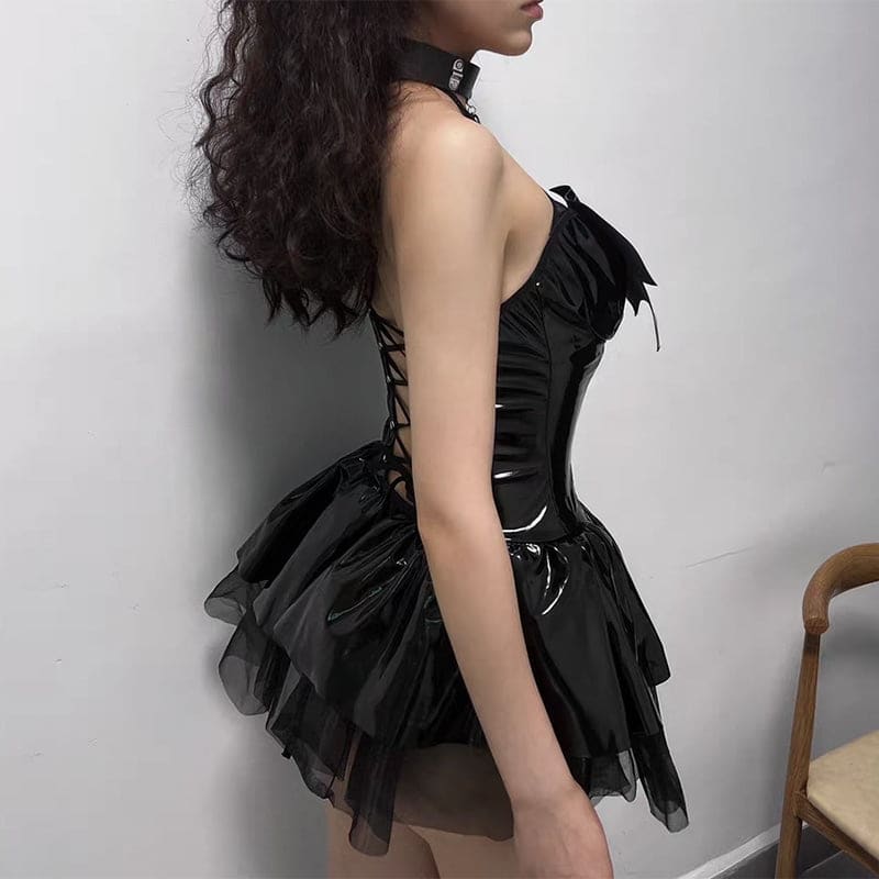 Back view of black patent leather demon priestess cosplay dress with lace-up back and layered tulle skirt