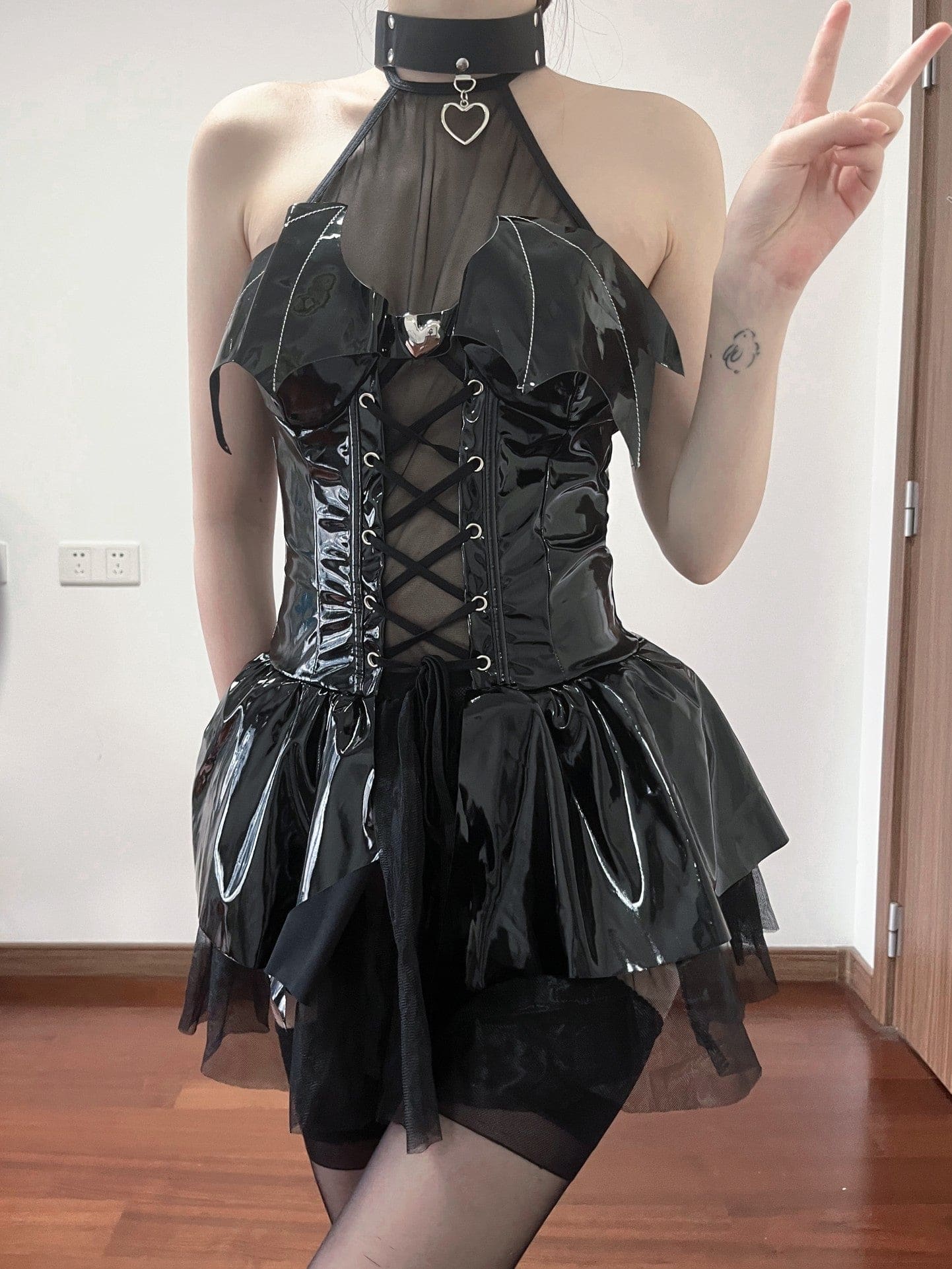 Black patent leather demon priestess dress with bat-wing accents and lace-up front perfect for cosplay dress looks