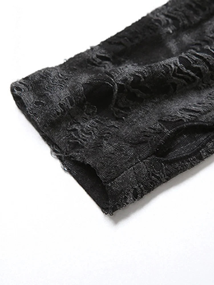 Close-up of distressed sleeve texture on gothic hooded crop top