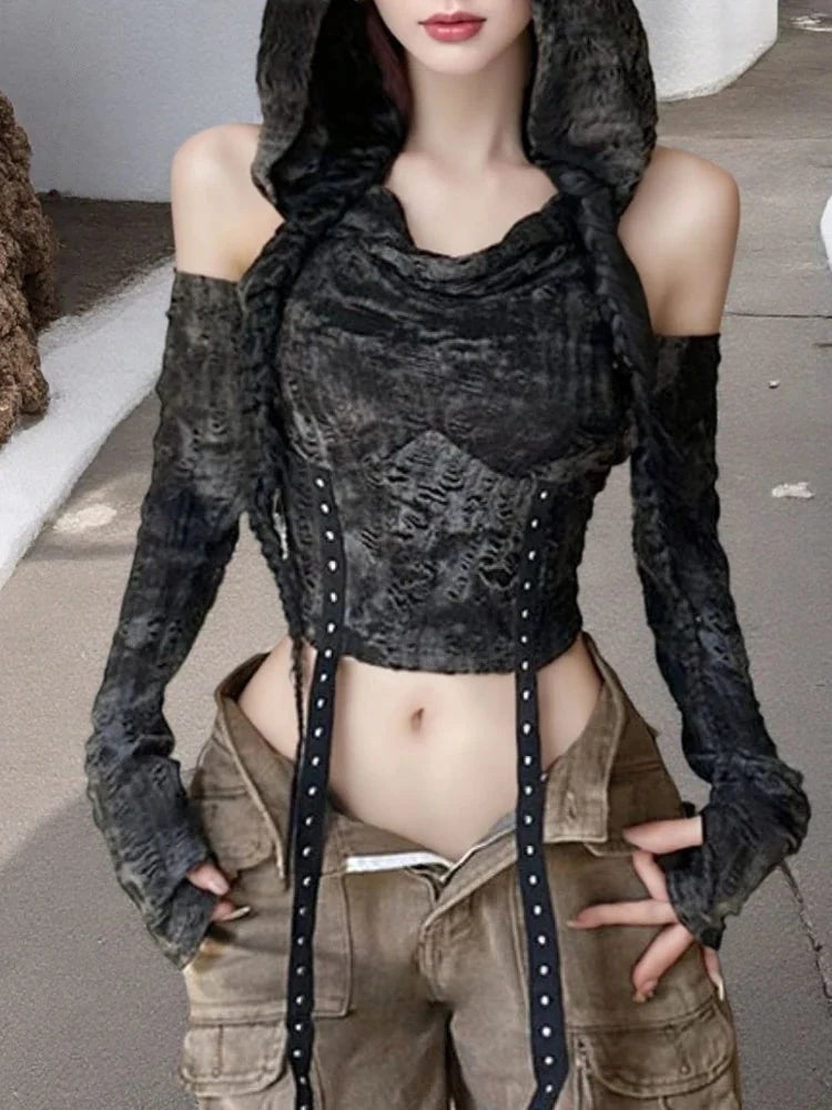 Outdoor front view of witchy hooded crop top with hanging studded straps