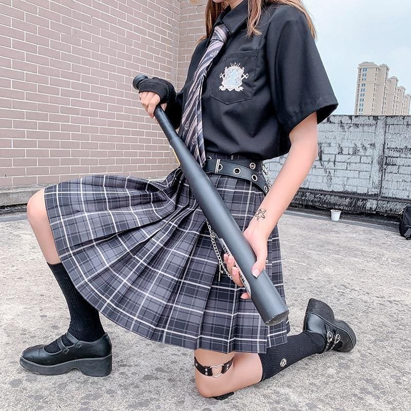Black plastic baseball bat with matte finish and textured grip displayed alongside electric plaid skirt in 17 color options