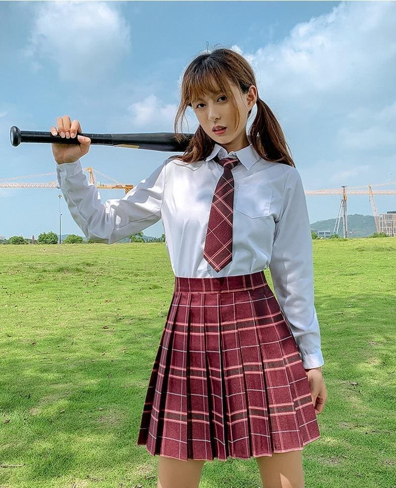 Electric plaid skirt in maroon and white plaid pleated design with multiple color options perfect for school girl style