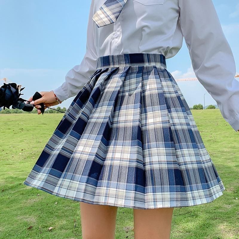 A pleated blue and white plaid skirt with a high waistband from electric plaid skirt collection with 17 color options perfect for school girl style