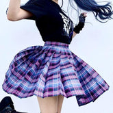 A flared lightweight plaid skirt in vibrant purple and blue perfect for school girl looks with multiple color options