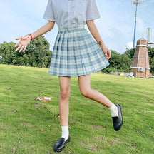 Pleated blue and white plaid skirt with fitted waistband perfect for a school girl look with 17 color options