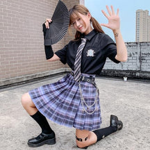 Black and purple plaid skirt with pleats and silver chain belt detail in school girl style with multiple color options