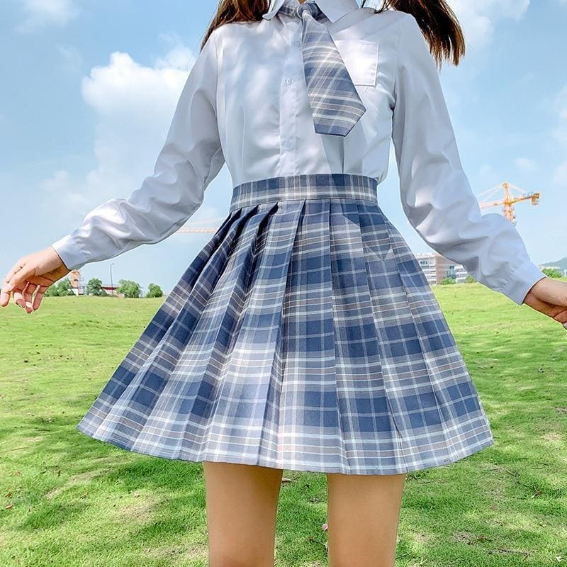 Pleated blue and white plaid skirt with fitted waistband perfect for school girl looks with multiple color options