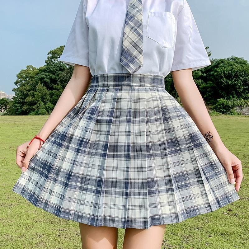 Pleated school girl plaid skirt in classic navy and white with crisp fabric and high waistband color options available