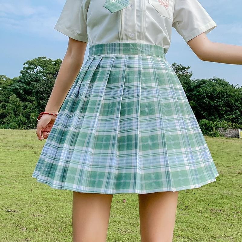 A pleated green and white plaid skirt with matching waistband perfect for school girl style and color options