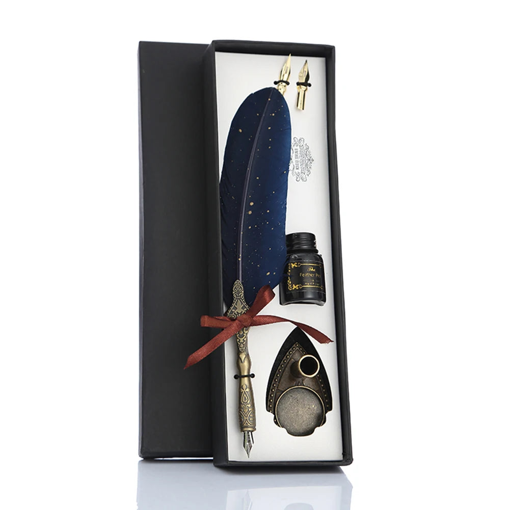 Blue feather dip pen gift set displayed in its fitted box with spare nibs, bottle and pen stand.