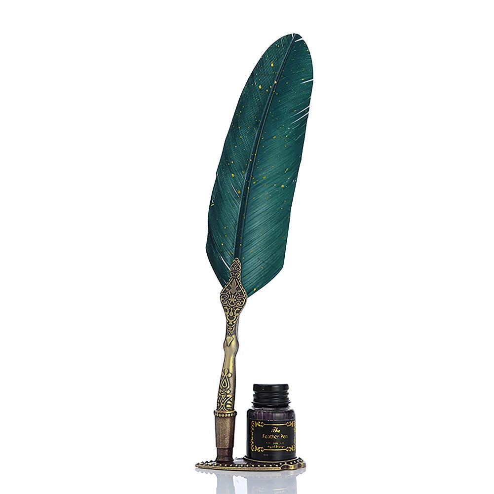 Green feather dip pen with an antique-tone decorated handle and matching stand beside a bottle.