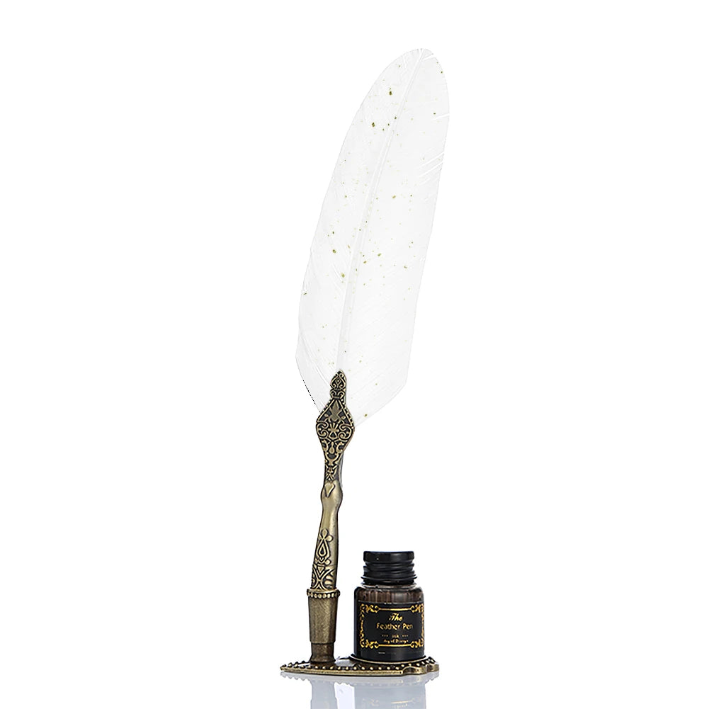 White feather quill with gold-coloured speckles and an ornate handle, standing beside its bottle.