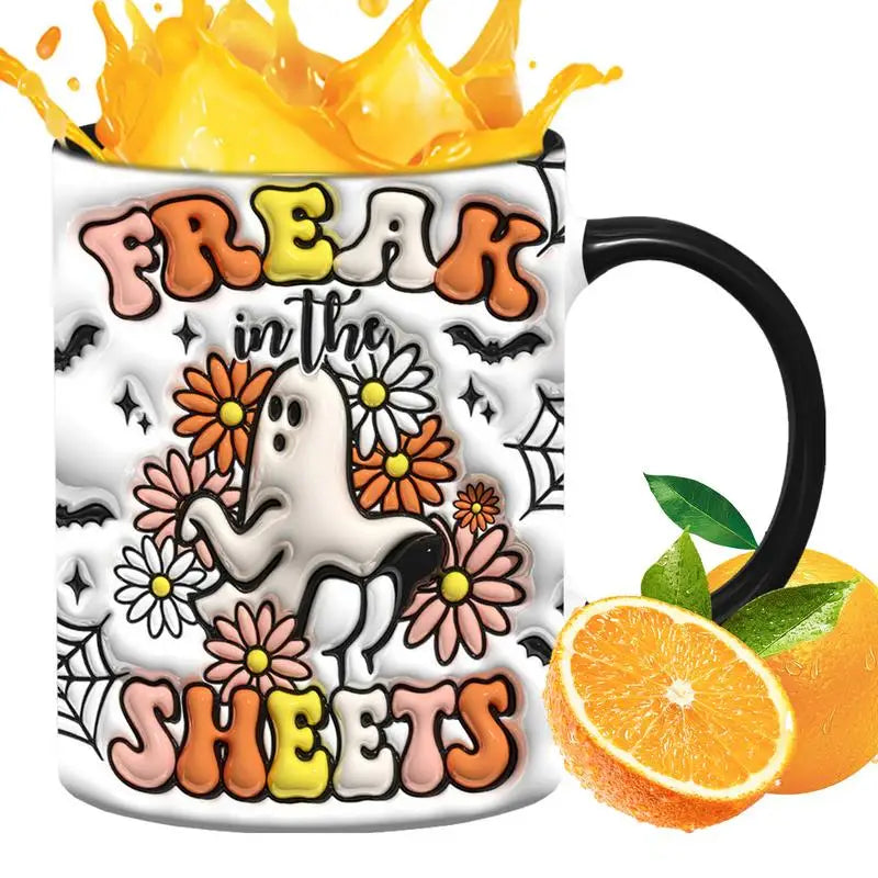Freak in the Sheets ghost mug with a black handle, shown in a drink mockup with an orange splash and orange slices.