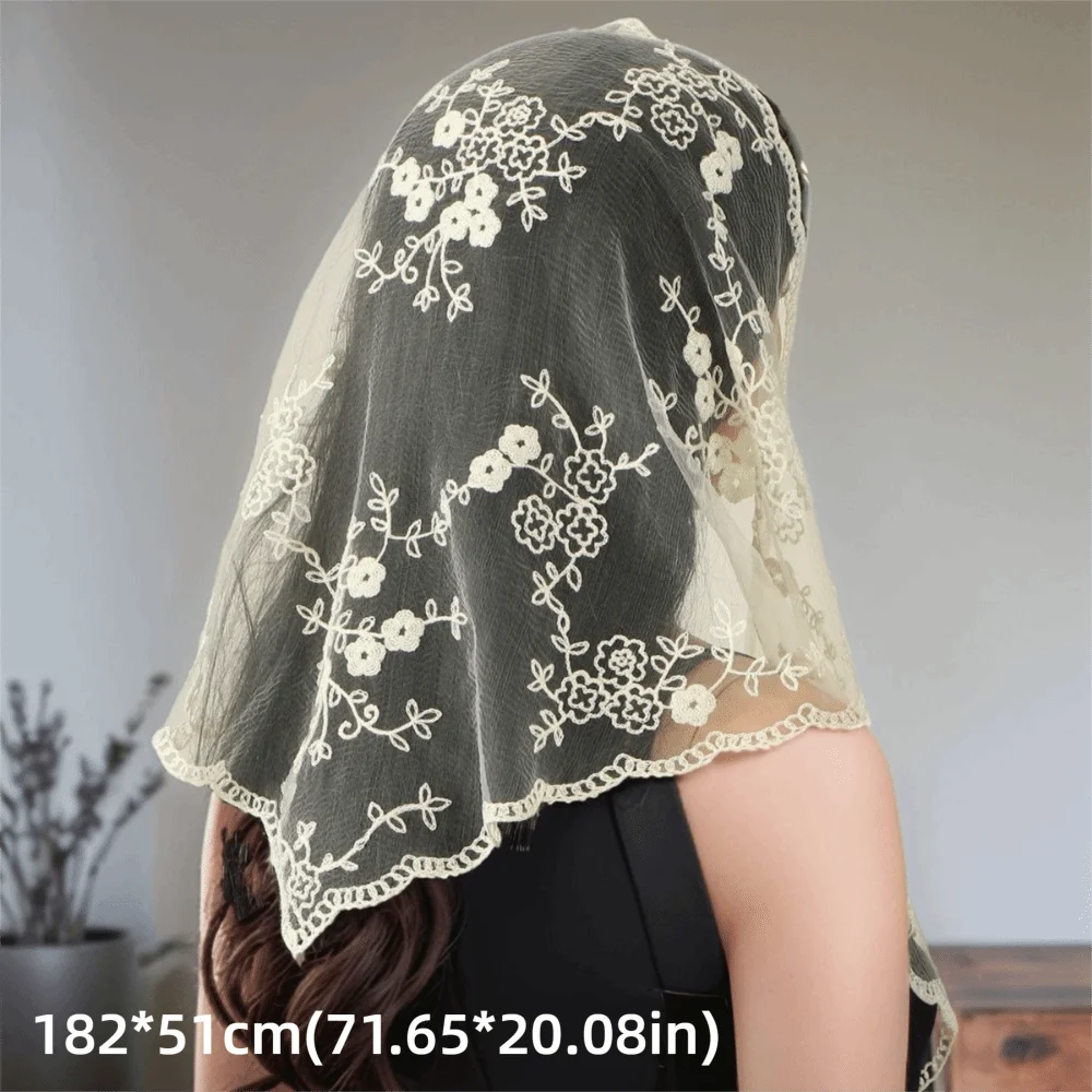 Beige lace hair scarf draped over dark hair, showing its floral pattern and scalloped border with dimensions below.