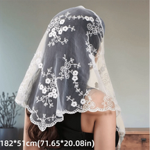 White floral lace triangle headscarf over dark hair, with scalloped borders and printed dimensions.