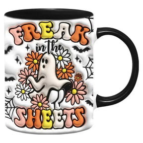 Black-handled mug with Freak in the Sheets lettering and a white ghost surrounded by colourful flowers.