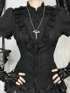 Front view of black Victorian-inspired button blouse with ruffled panels