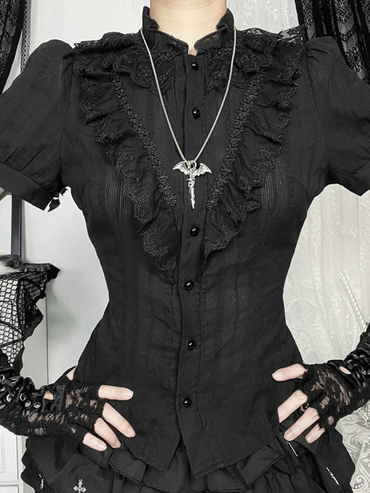 Front view of black Victorian-inspired button blouse with ruffled panels