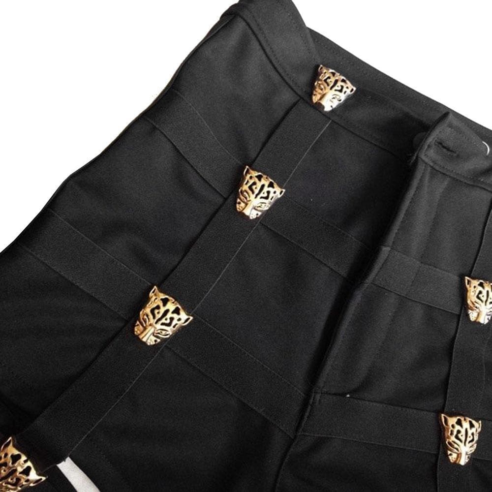 Black pleated garter shorts built with gold-toned tiger head embellishments for a bold belt built look
