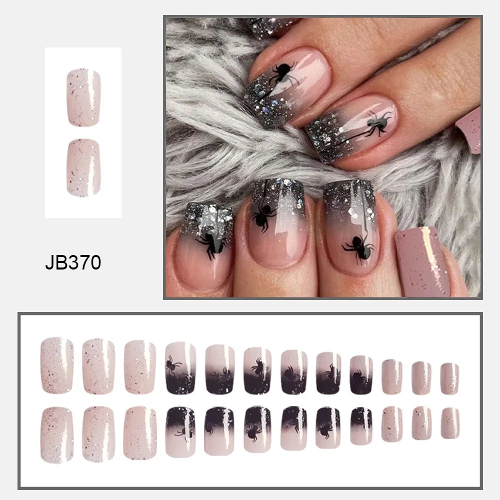 Pink square false nails with dark glitter tips and black spiders, shown on hands and in a complete size layout.