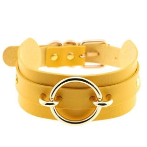 Yellow leather choker necklace with a silver-toned vegan leather o-ring and matching buckle called golden o-ring collar
