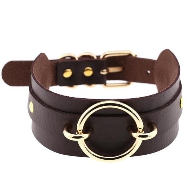 Dark brown vegan leather choker necklace with a golden o-ring centerpiece and matching metallic hardware perfect for edgy looks