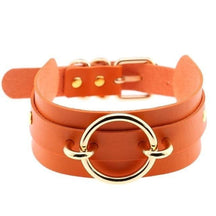 Orange leather choker necklace with golden o-ring centerpiece and matching vegan leather o-ring buckle clasp