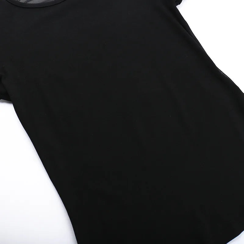 Close-up of the opaque black front panel and stitched lower edge of the angel T-shirt.